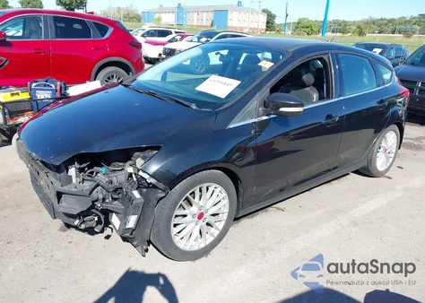 2014 Ford Focus Titanium z USA, uszkodzony, nr VIN 1FADP3N25EL188504